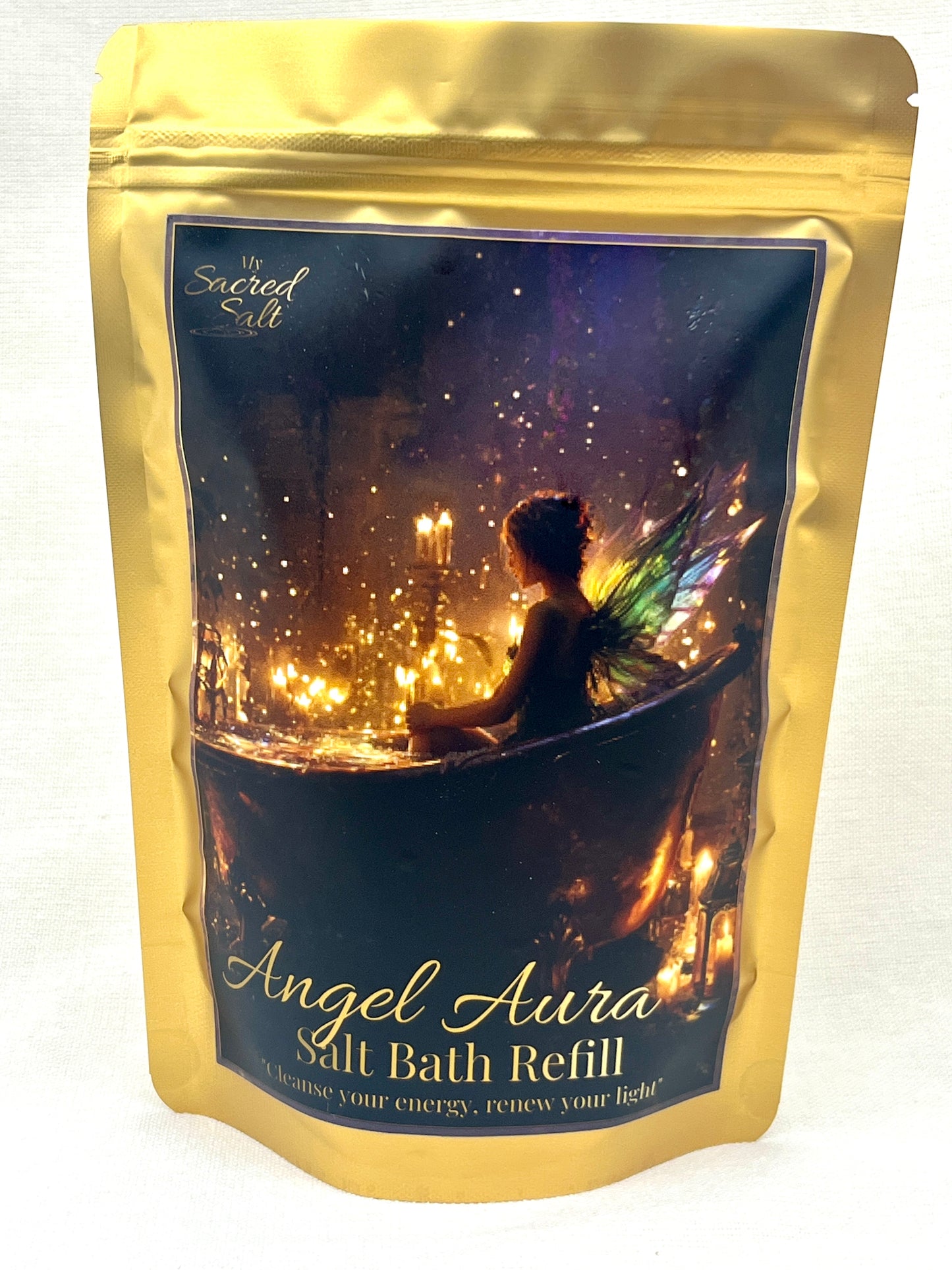 Gold packaging of Angel Aura Salt Bath Refill with a fairy silhouette with flickering candles.