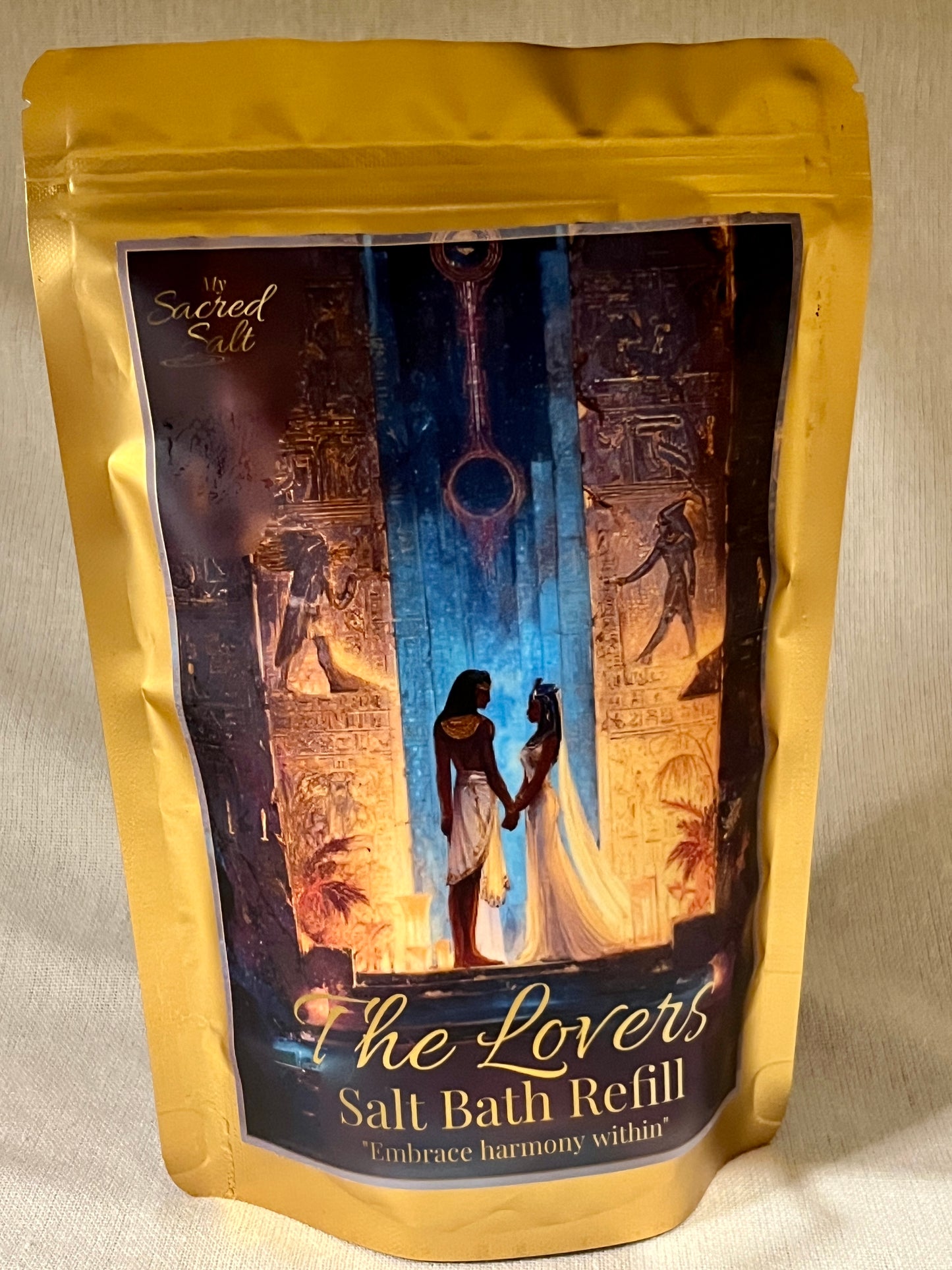 Salt bath refill package with Egyptian 'The Lovers' design on a beige background