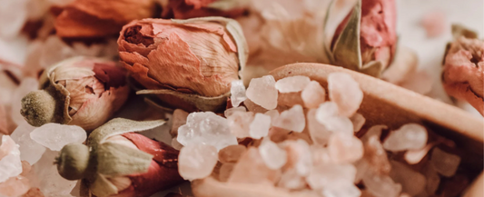 A self-love ritual bath with mineral salts and warm water designed to support calm and burnout recovery