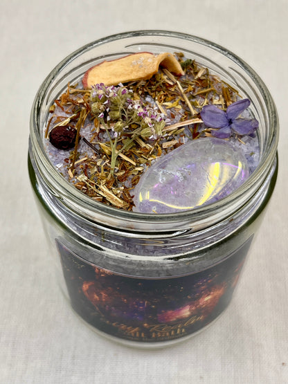 Glass jar with dried herbs and a butterfly on a white background