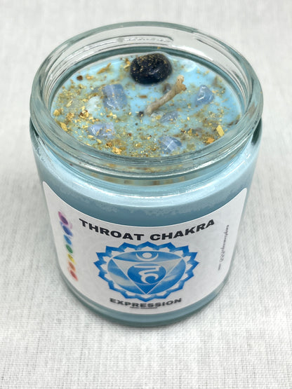 Candle in a glass jar labeled 'Throat Chakra Expression' on a white background