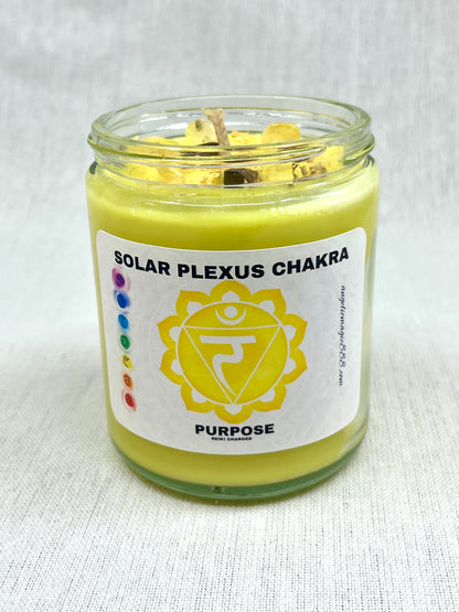 Candle in a glass jar labeled 'Solar Plexus Chakra' with a white background