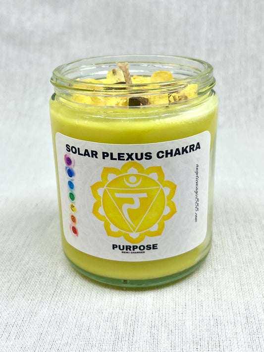Candle in a glass jar labeled 'Solar Plexus Chakra' with a white background