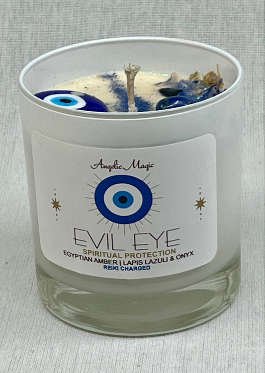 Candle with 'Evil Eye' label and decorative elements on a gray background