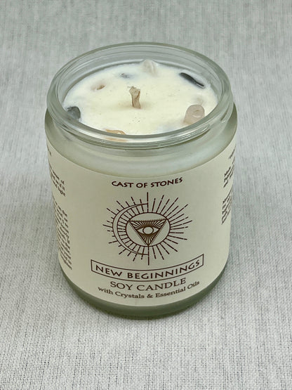 Soy candle in a glass jar with a label on a gray fabric background
