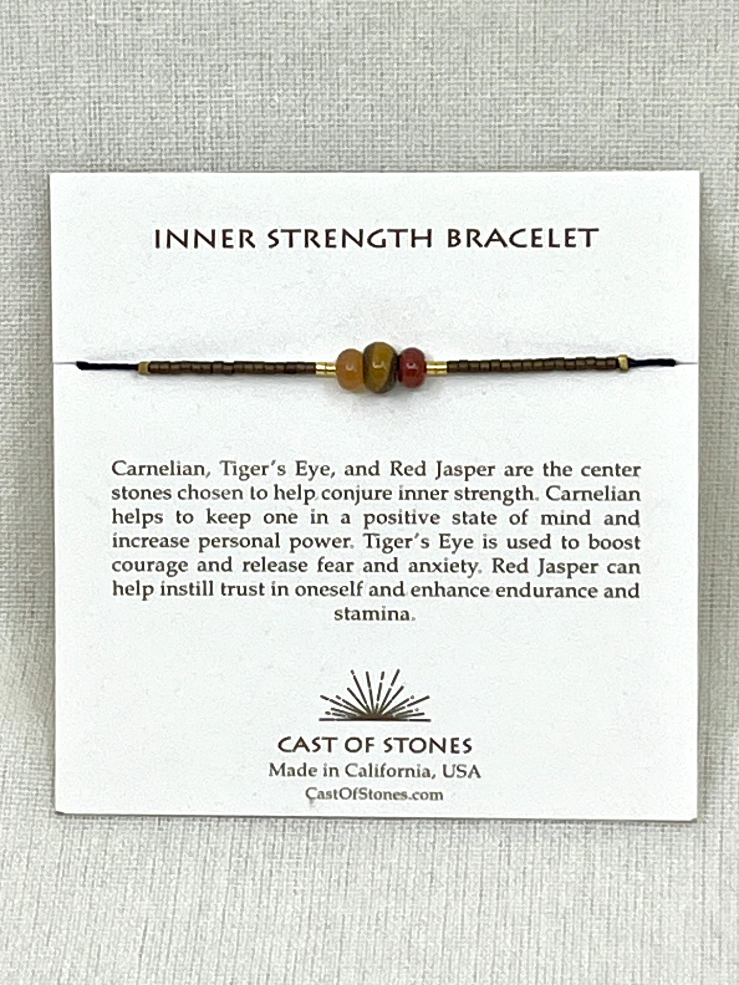 Inner Strength Bracelet on a white card with product description and brand information.