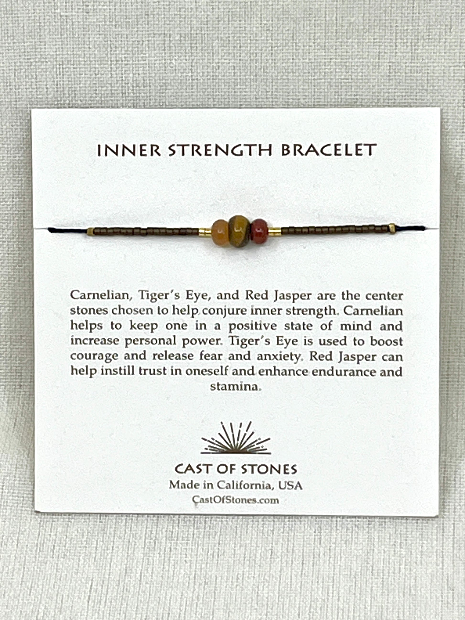 Inner Strength Bracelet on a white card with product description and brand information.
