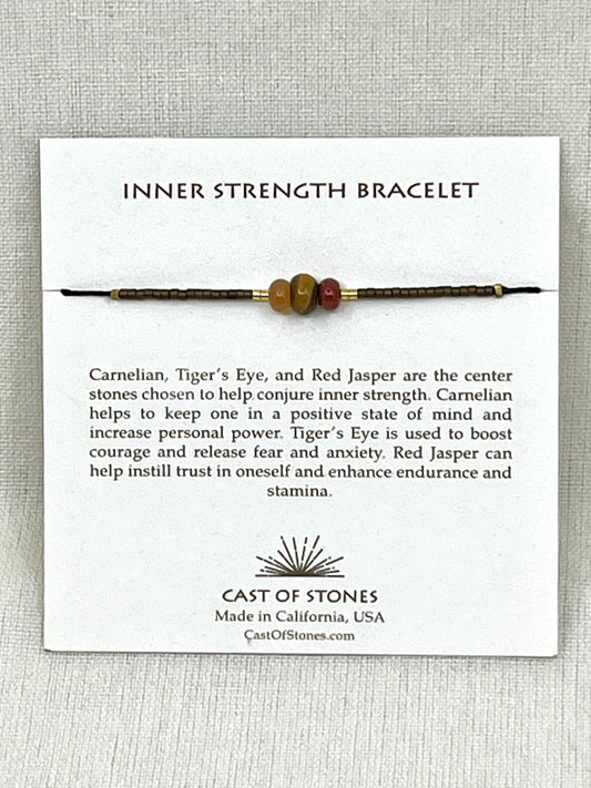 Inner Strength Bracelet on a white card with product description and brand information.