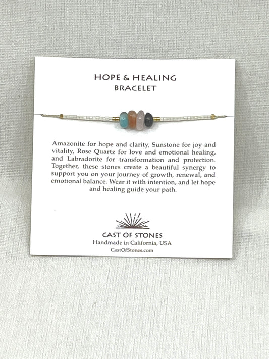 Hope & Healing Bracelet with description card on a gray background
