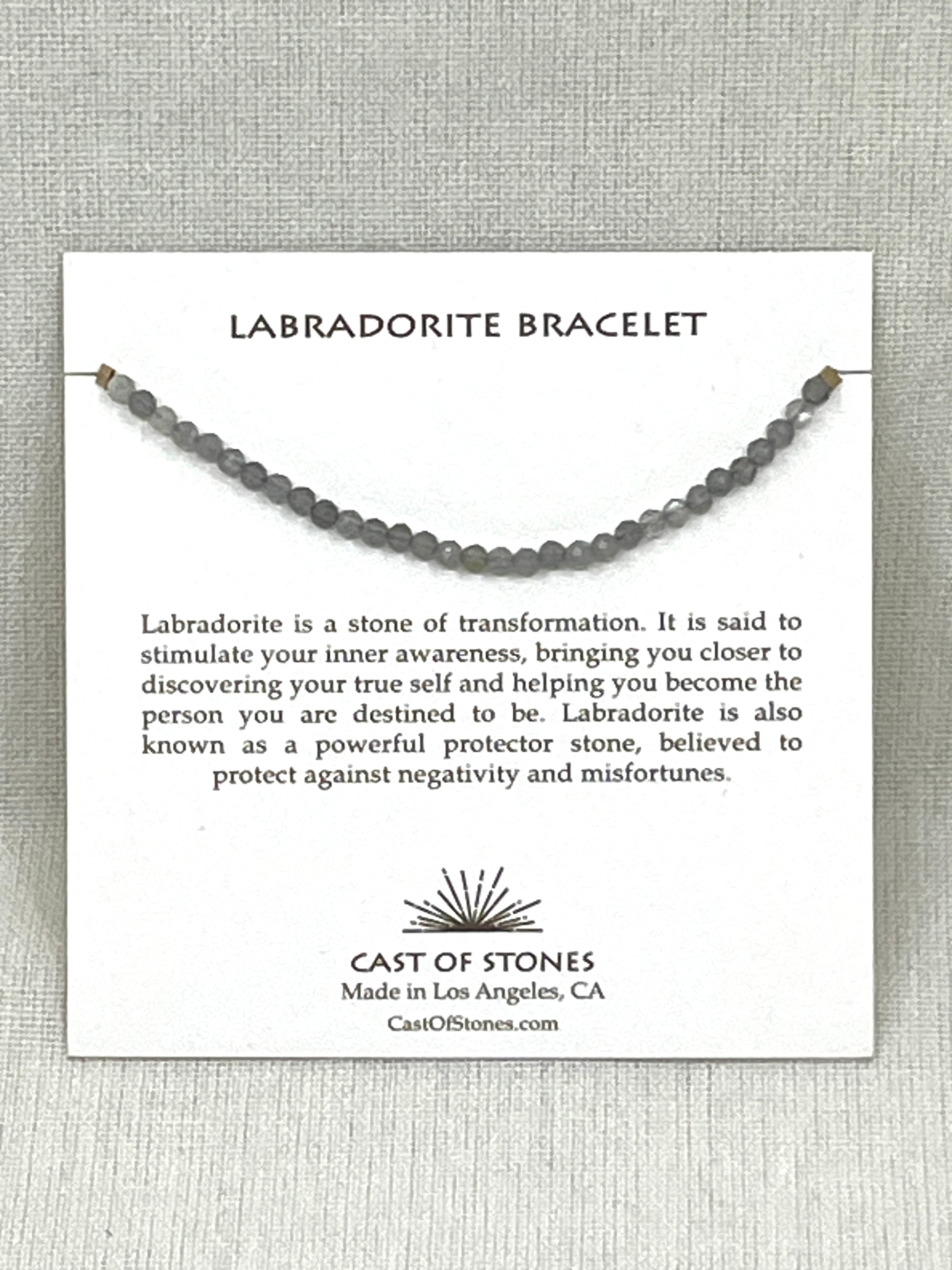 Labradorite bracelet on a display card with information about the stone and brand.