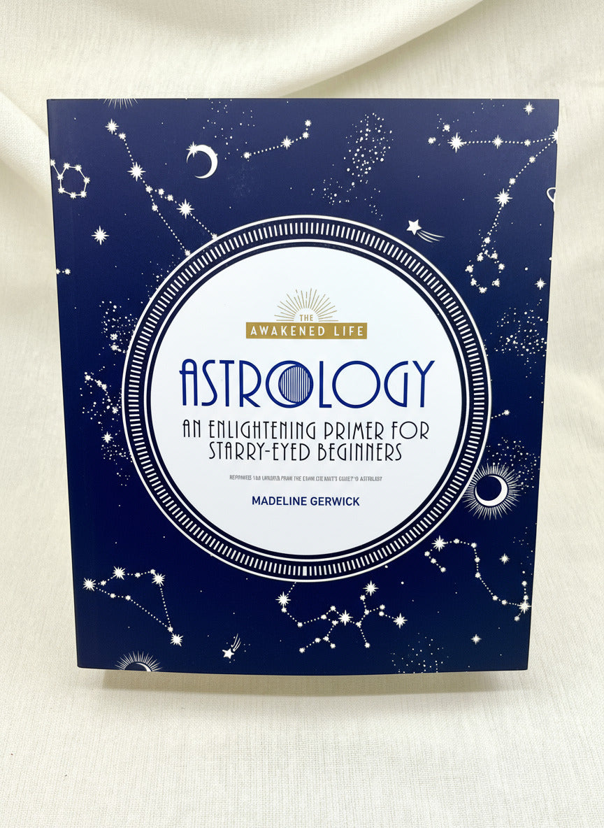 Book titled 'Astrology: An Enlightening Primer for Starry-Eyed Beginners' by Madeline Gerwick on a white background