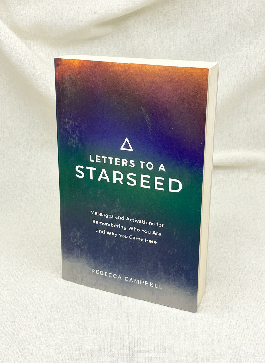 Book titled 'Letters to a Starseed' by Rebecca Campbell on a white background