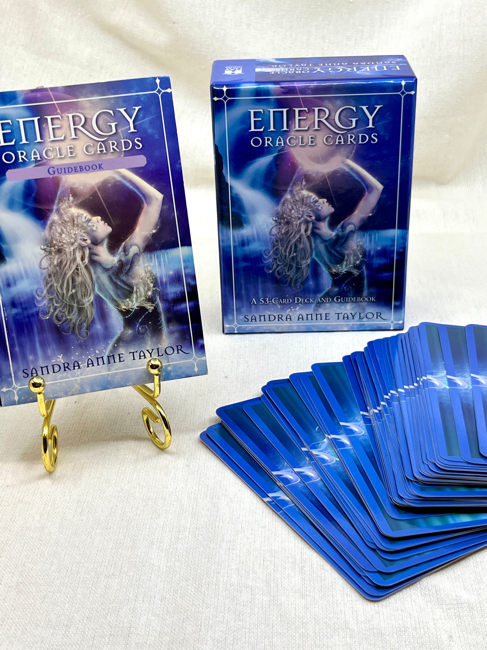 Energy Oracle Cards by Sandra Anne Taylor with cards and guidebook on a white background