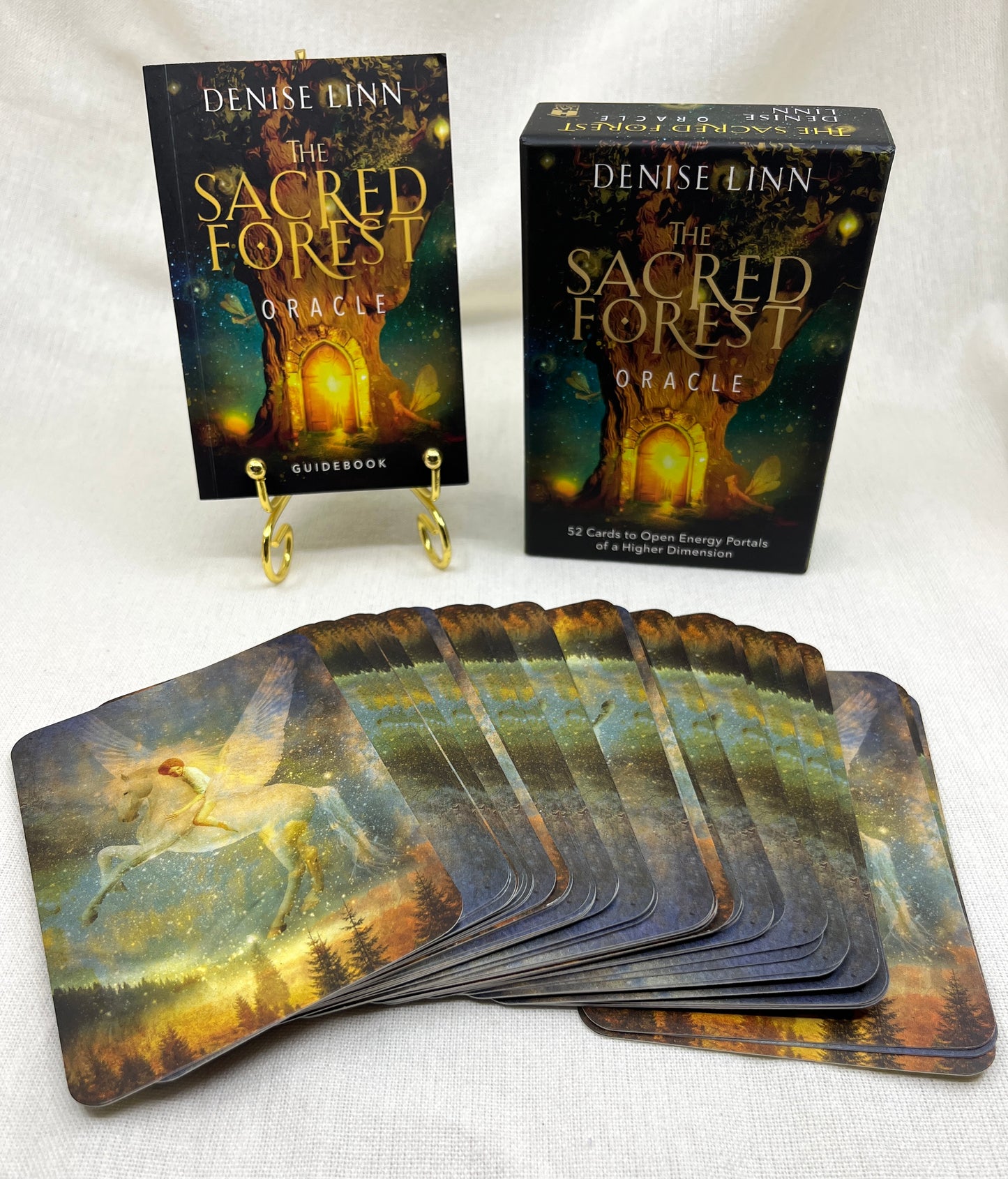 The Sacred Forest Oracle cards by Denise Linn on a white background