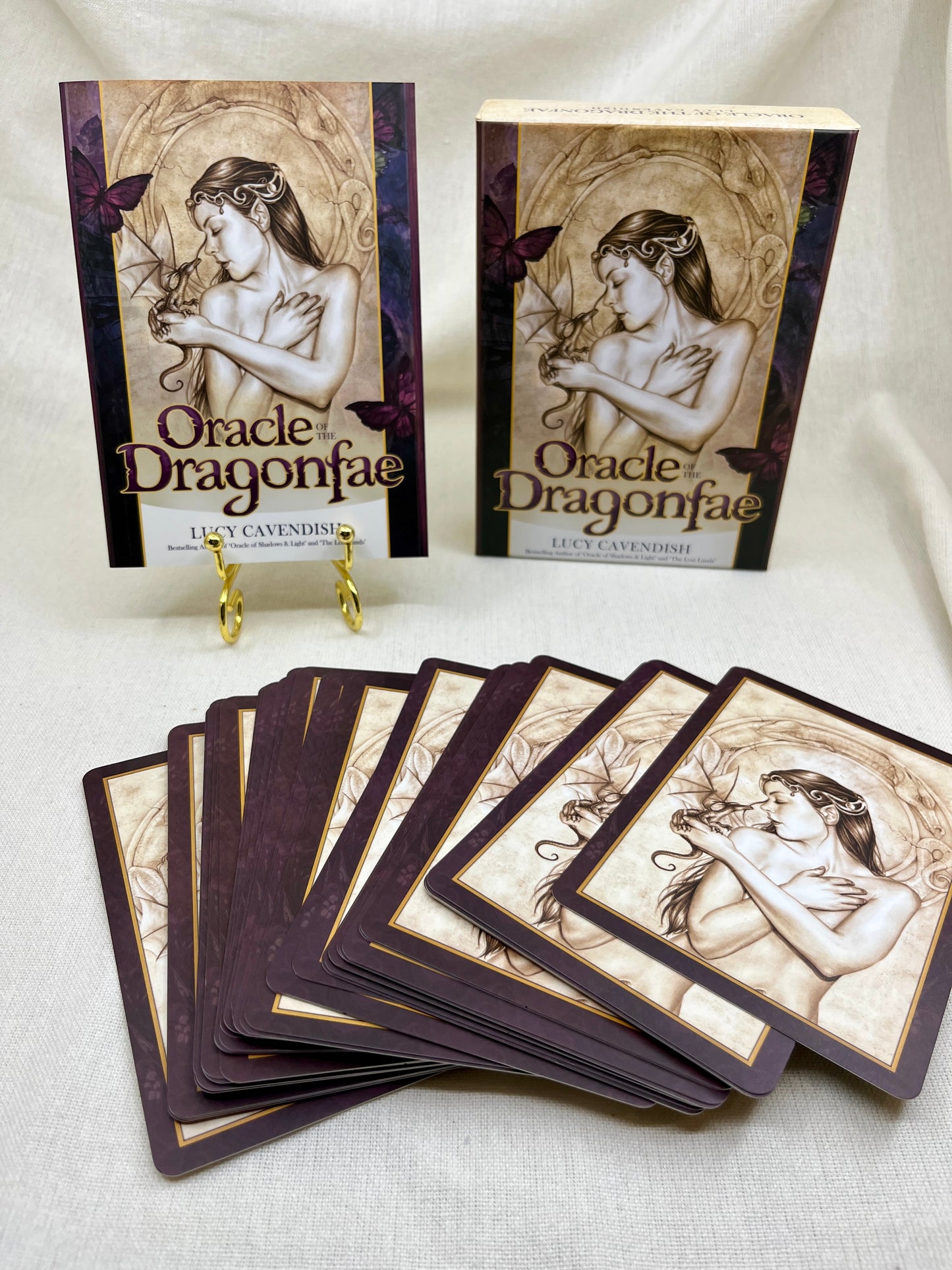 Oracle Dragonfae cards with a stand on a white background