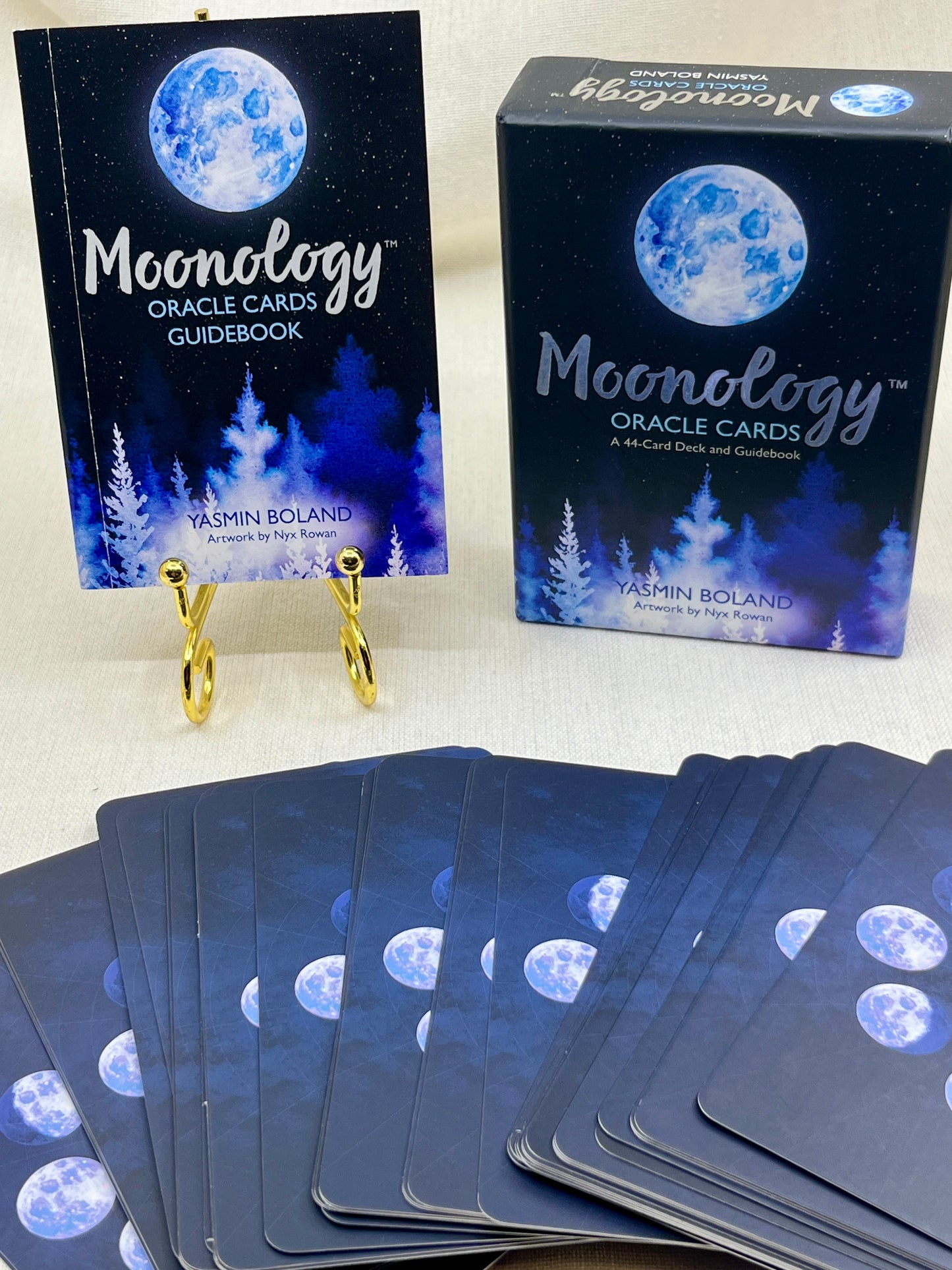 Moonology Oracle Cards with guidebook and packaging on a white background