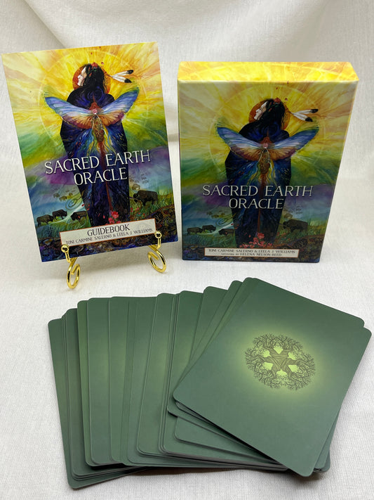 Sacred Earth Oracle cards with colorful box on a white surface