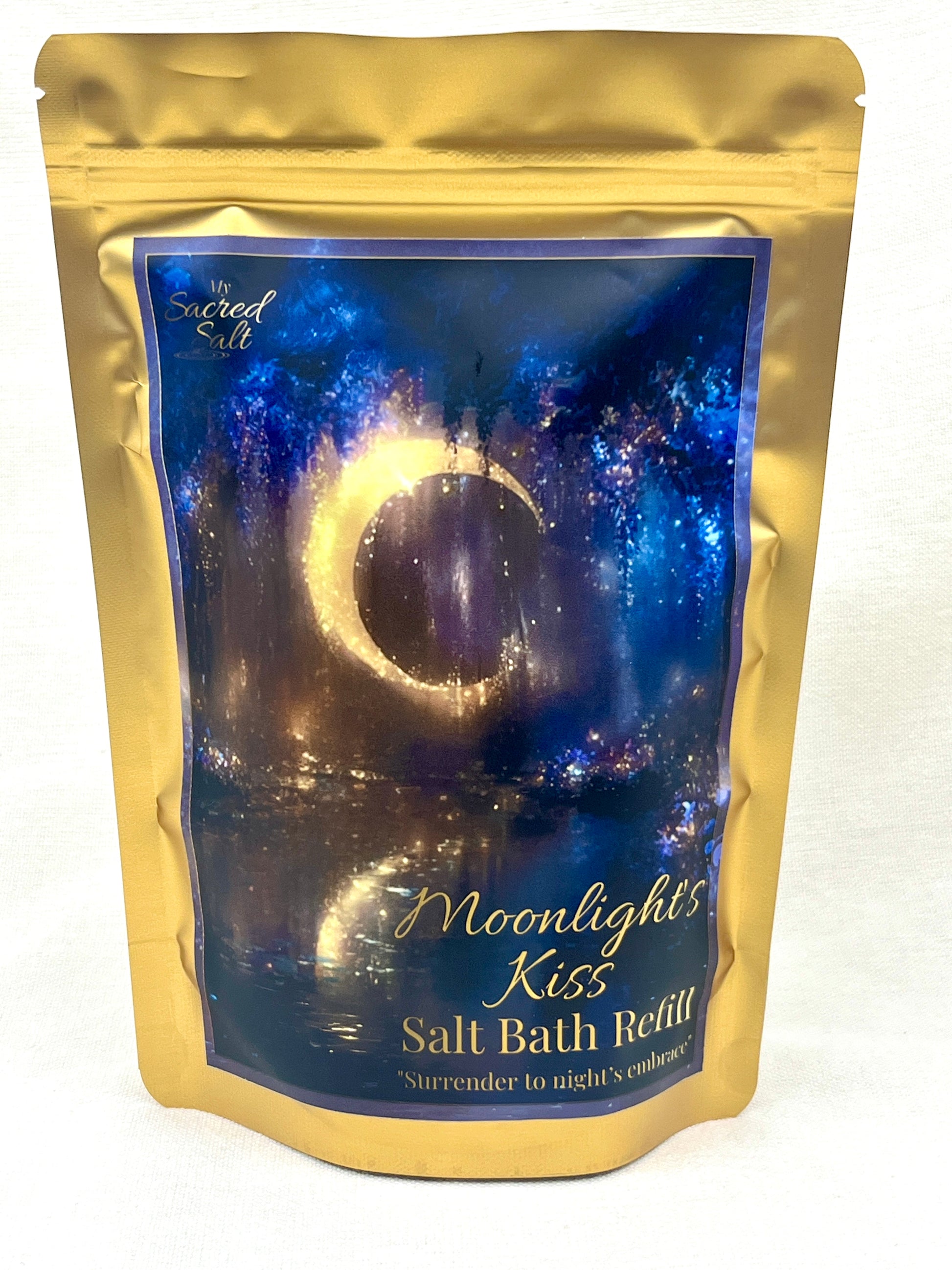 Salt bath refill package with moonlit design reflected in water and a gold border