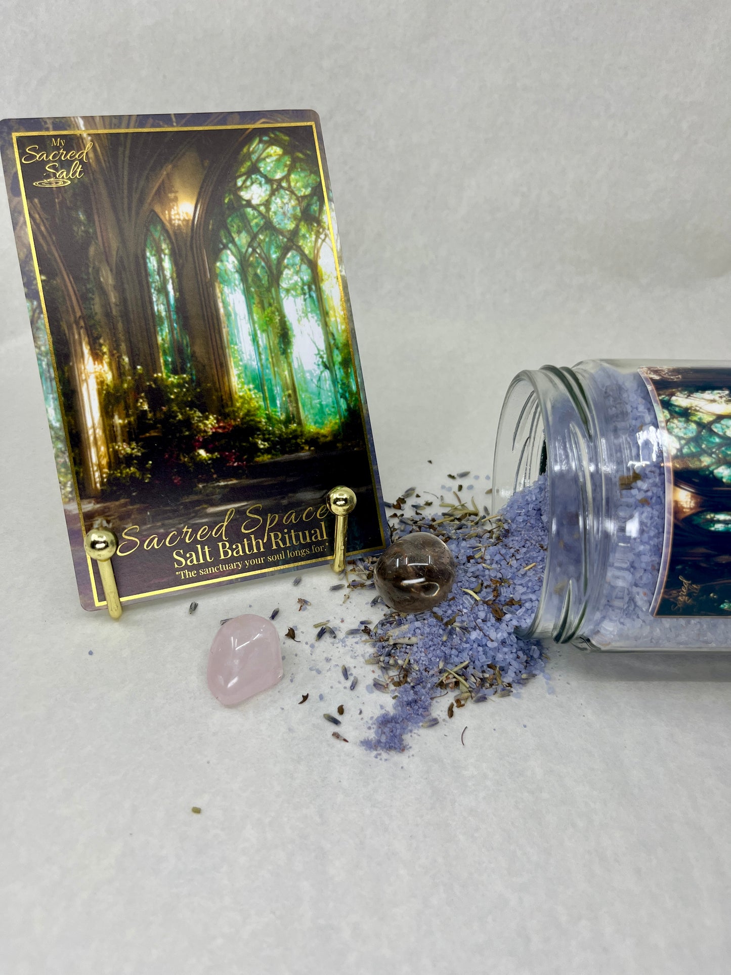 Salt bath ritual packaging with a jar of salt and lavender flowers on a light gray background