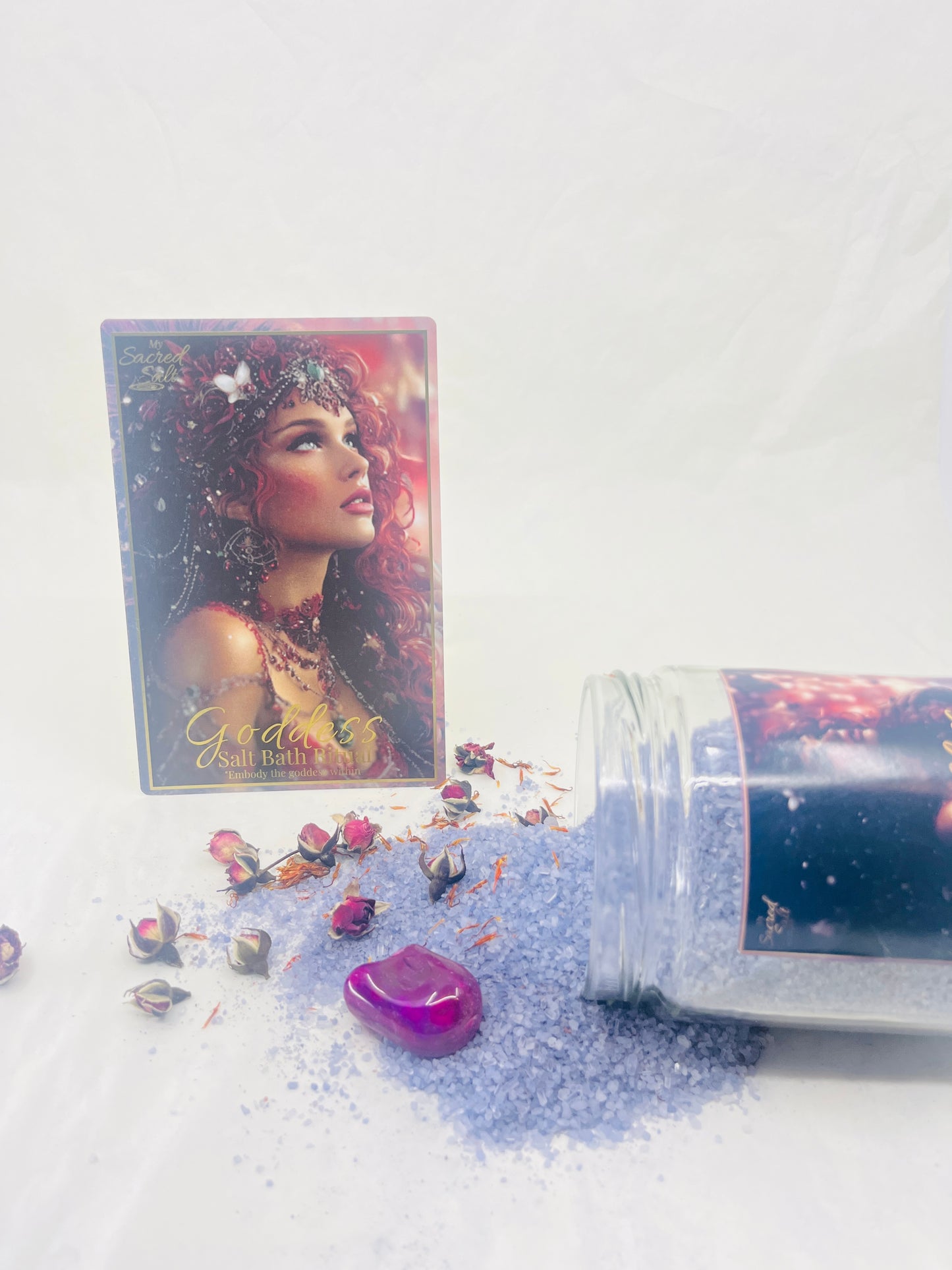Cosmetic product with a jar and packaging featuring a celestial design on a white background