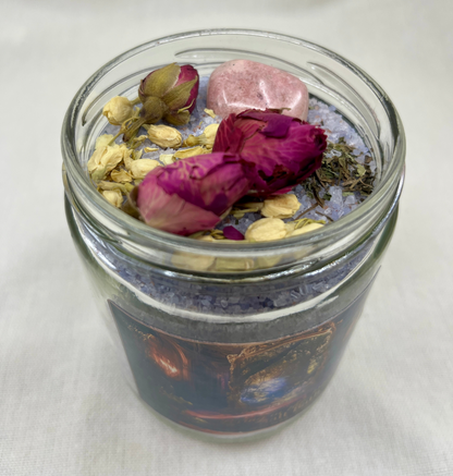 Glass jar with dried flowers and herbs on a white background
