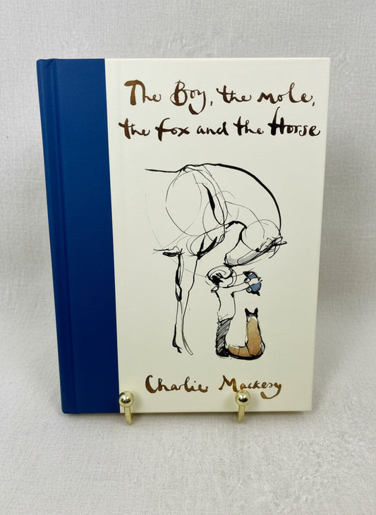 Image of the hardcover book "The Boy, The Mole, The Fox and The Horse" by Charlie Mackesy on a ivory backdrop