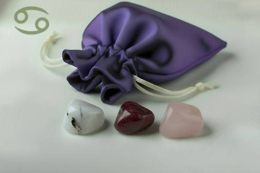 Purple drawstring bag with three colorful stones on a light background