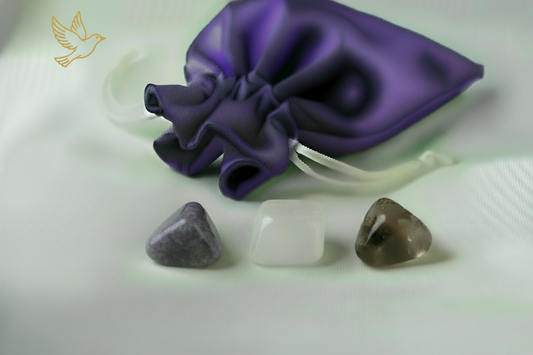 Purple satin drawstring bag with three stones on a light background