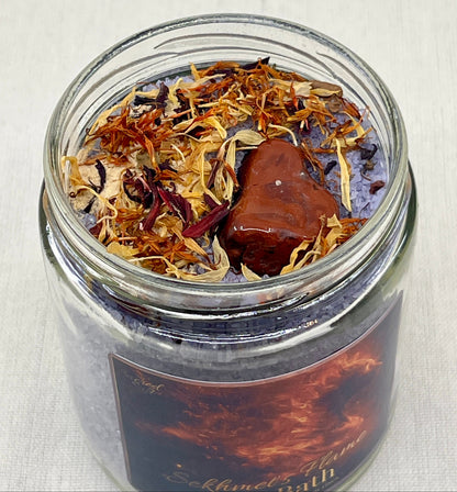 Glass jar with dried herbs and a label on a light background