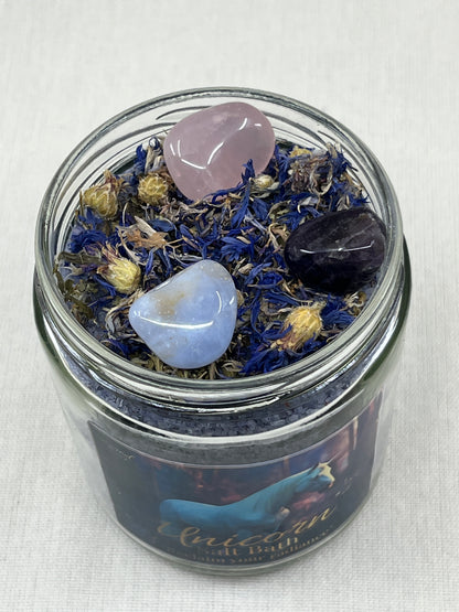 Glass jar with crystals and stones on a white background